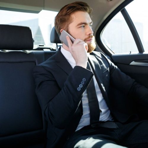 man sitting in taxi